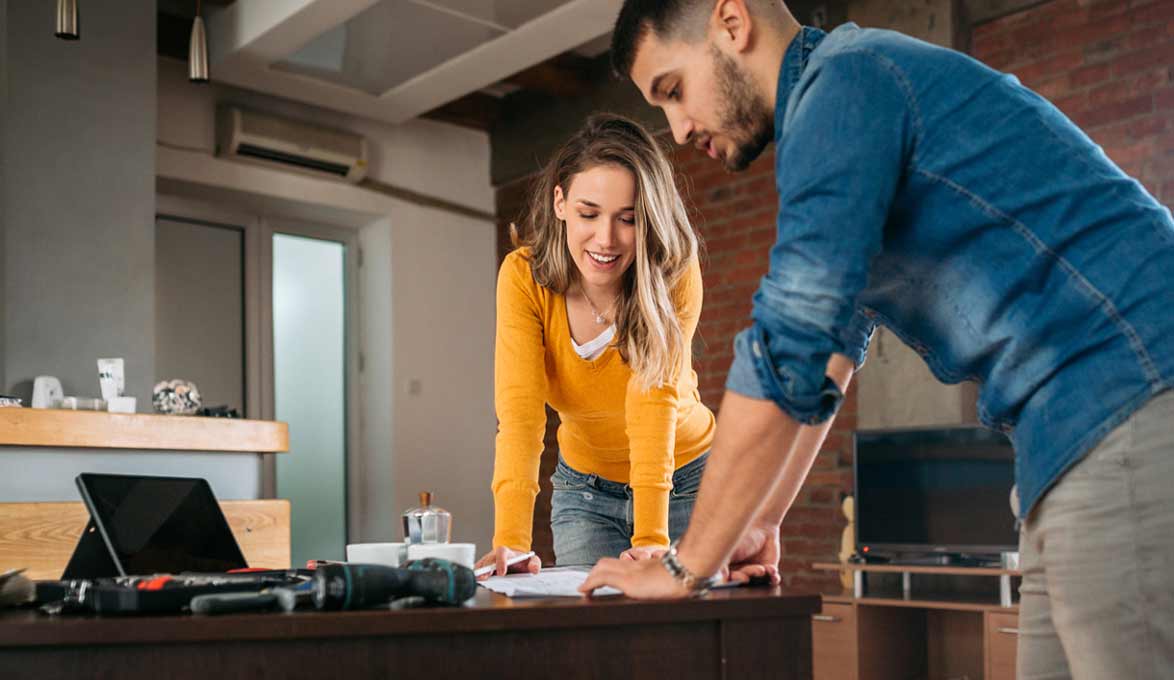 Couple reviewing home construction plans.